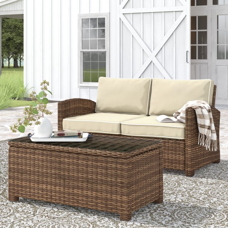 Lawson wicker loveseat with clearance cushions